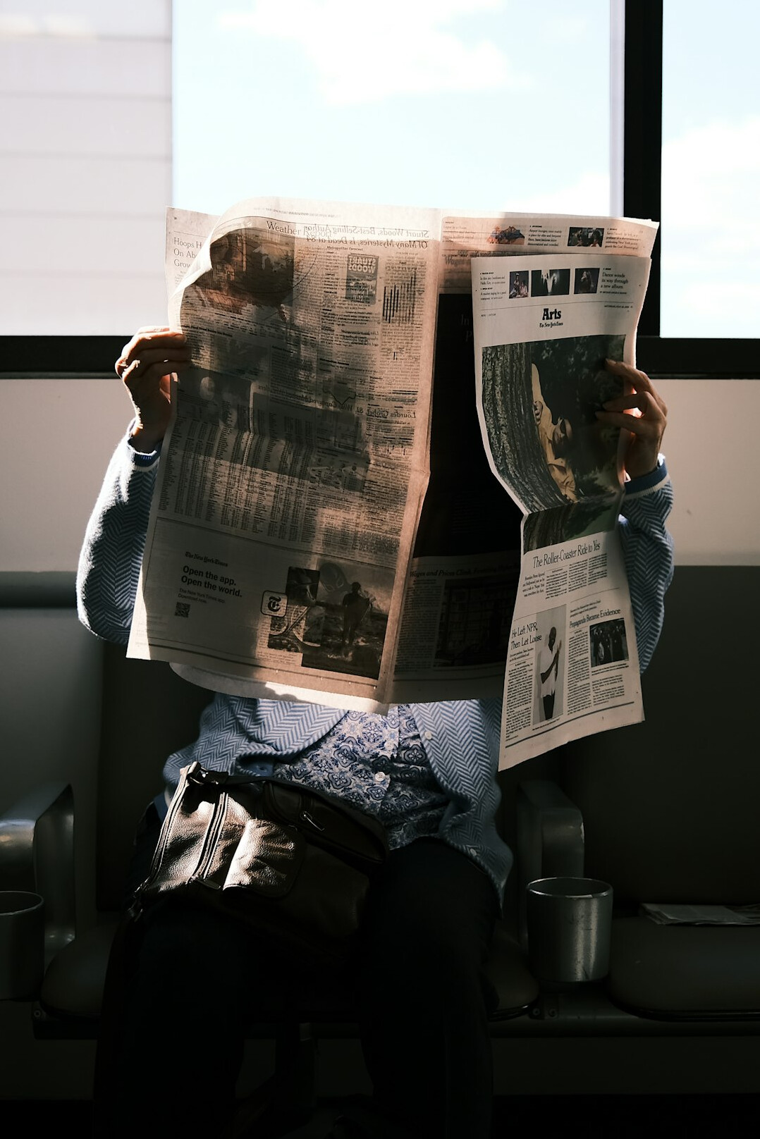 writer researching old newspaper