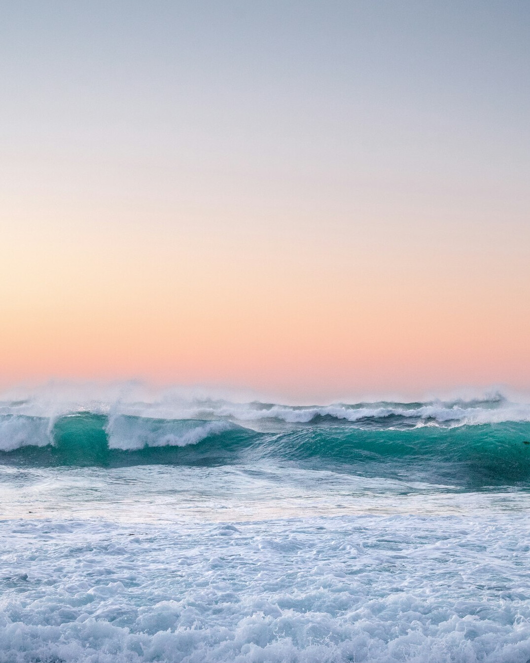 ocean waves at dusk